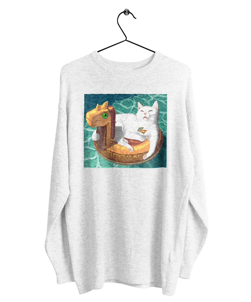 Белый кот в плавательном кругу, на отдыхе