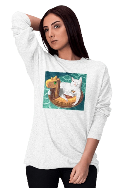 Белый кот в плавательном кругу, на отдыхе